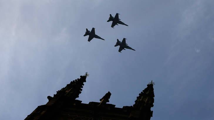 RAAF FA-18 Hornets fly over St Andrew's Cathedral during the memorial service of former Australian Prime Minister Gough Whitlam at Sydney Town Hall Photo: Daniel Munoz
