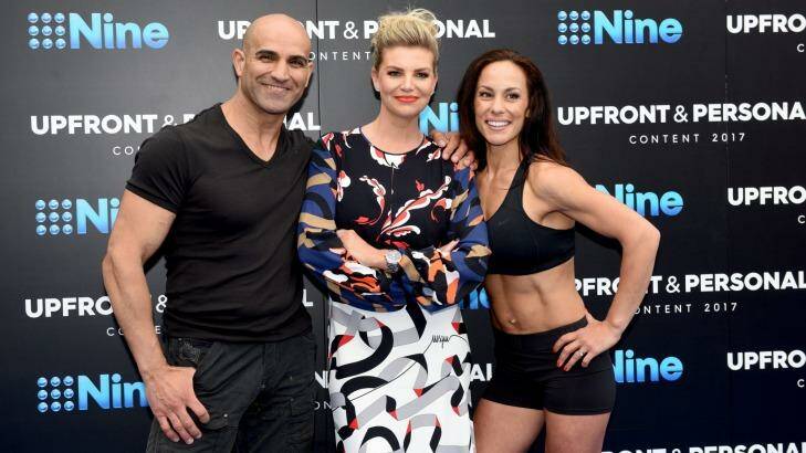 <i>Australian Ninja Warrior</i> host Rebecca Maddern with contestants, husband and wife team Zac and Amanda.  Photo: Steven Siewert