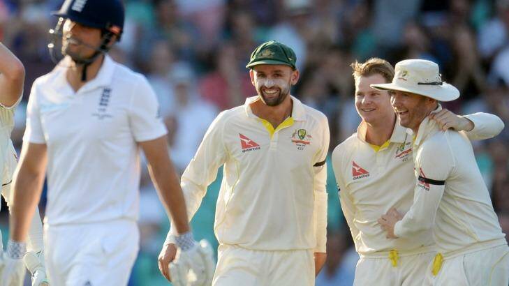 Michael Clarke and Nathan Lyon congratulate Steve Smith after the dismissal of England's Alastair Cook.
Reuters / Philip Brown
Livepic Photo: Philip Brown