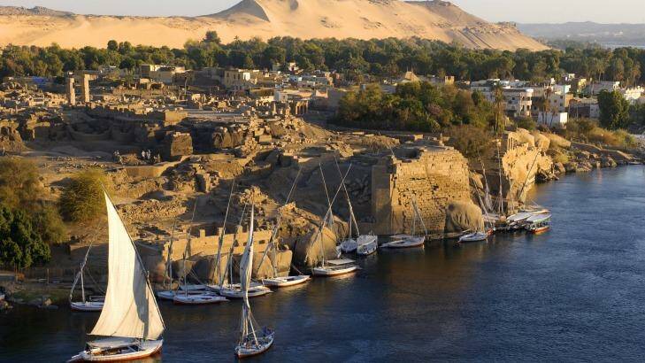 Feluccas moored at the ancient ruins of Swenet in Aswan The Nile River, Egypt.