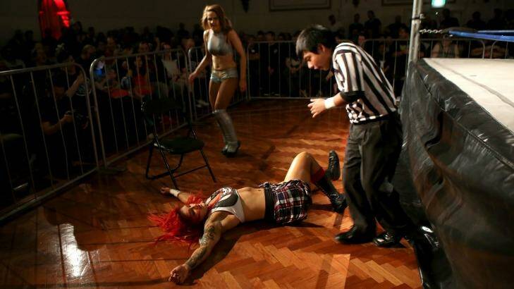 Kellyanne (on ground) takes on Evie during a Melbourne City Wrestling bout on December 2, 2016. Photo: Pat Scala
