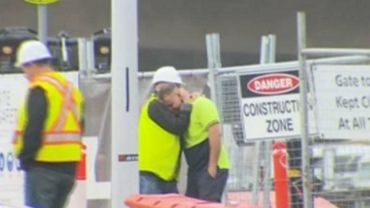 Distressed construction workers at the scene. Photo: Courtesy of Ten News