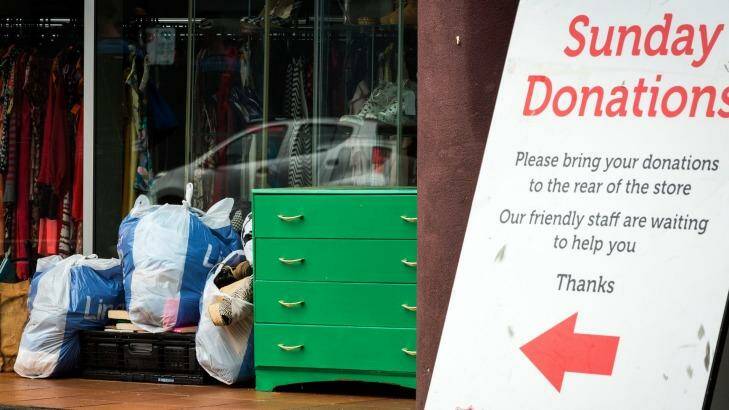 Items left in front of a Salvation Army store in Abbotsford on Monday in front of a sign that asks people to drop goods at the back.  Photo: Chris Hopkins