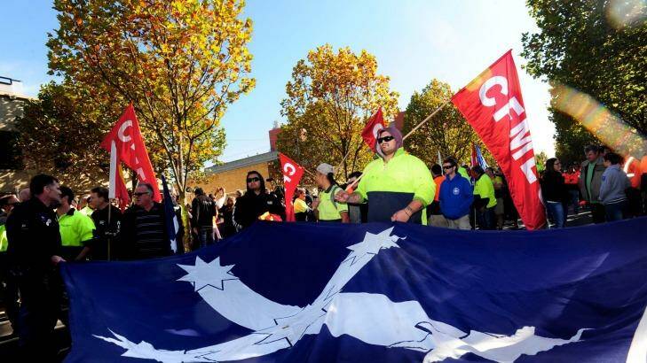 Unionists carry a Eureka flag. Photo: Penny Stephens