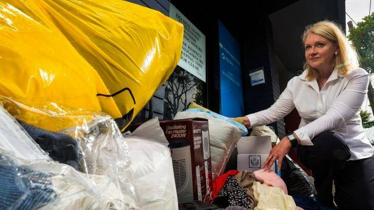 Kerryn Caulfield is urging people to not dump goods outside charity stores. 
Ms Caulfield with donated items left in front of the Salvation Army store on Burwood Road, Hawthorn on Monday.  Photo: Chris Hopkins