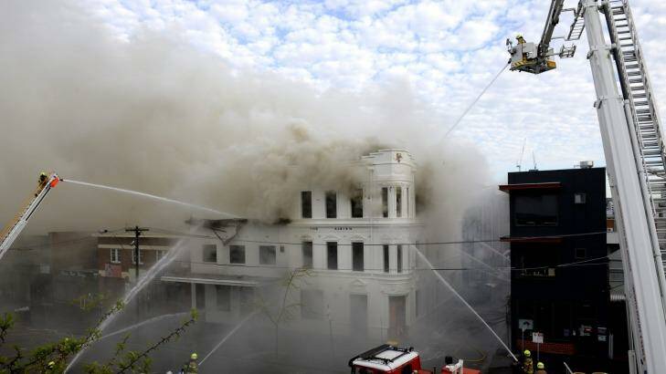 The Albion rooftop in York Street is  engulfed by fire on Monday. Photo: PENNY STEPHENS