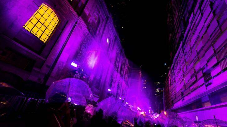 Melburnians enjoy the Purple Rain installation. Photo: Chris Hopkins