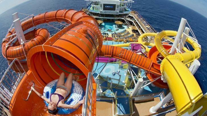 A guest onboard Carnival Vista slides down Kaleid-O-Slide. Photo: Andy Newman