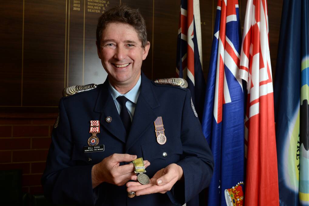 Humble: Sebastopol Fire Brigade Lieutenant Bill Cook displays the National Emergency Medal he and fellow firefighter Gary Parker received for their work during the Black Saturday fires. PICTURE: KATE HEALY