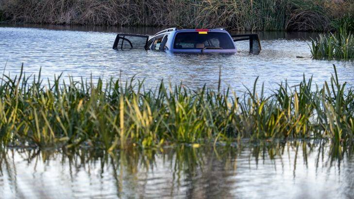 The car submerged in Lake Gladman, off Manor Lakes Boulevard in Wyndham Vale. Photo: Luis Ascui