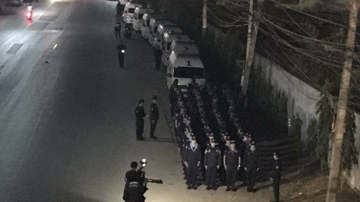 Columns of police form part of the stand-off at the temple. Photo: Supplied