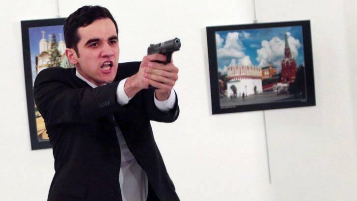 Turkish police officer Mevlut Mert Altintas shouts 'Don't forget Aleppo, don't forget Syria' after shooting dead the Russian Ambassador to Turkey. Photo: Burhan Ozbilici/AP