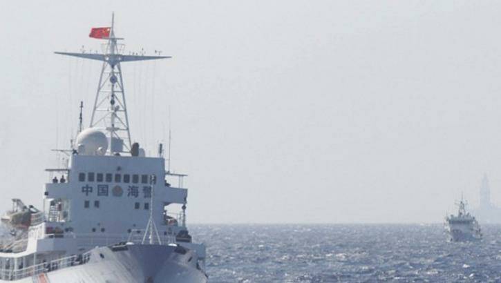 Ships of Chinese Coast Guard are seen near the Chinese oil rig Haiyang Shi You 981 in disputed waters in the South China Sea.