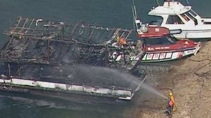 The charred remains of the house boat. Photo: Courtesy Seven News.