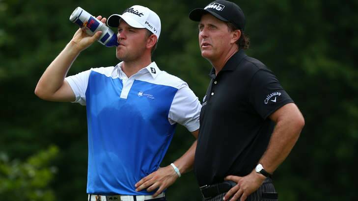 Drinks break: Bernd Wiesberger of Austria and Phil Mickelson of the United States talk during the final round of the 96th PGA Championship at Valhalla. Photo: Getty Images