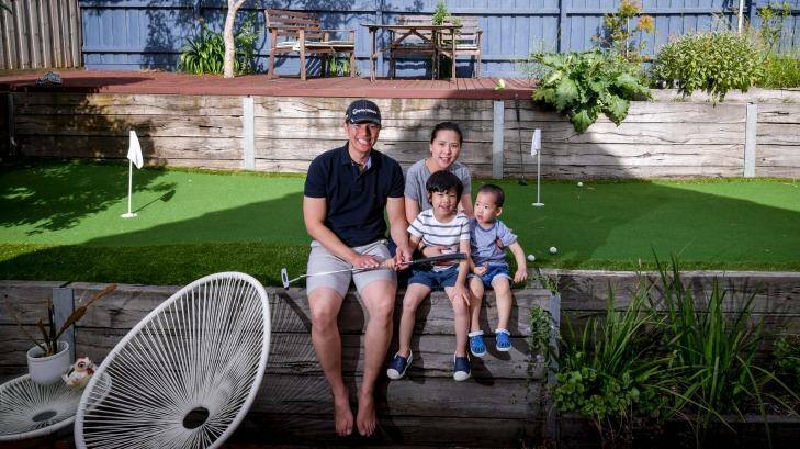Calan Choke with wife Jan and sons Dylan and Matthew at their backyard putting green.  Photo: Eddie Jim