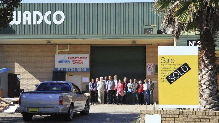Employees outside Wadco Lighting, Condell Park, after being retrenched without notice, 2015.  Photo: Ezra Benjamin
