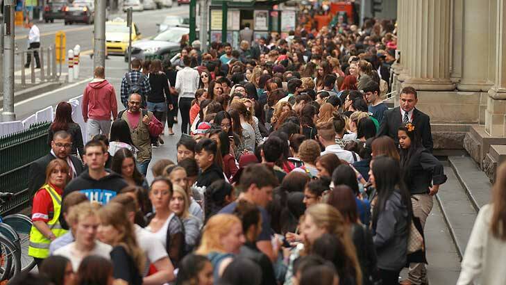 Crowds gather for the opening of H&M on Saturday. Photo: Ken Irwin
