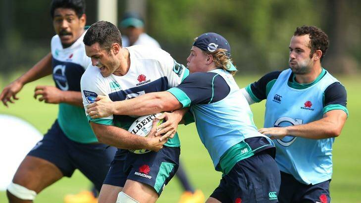 Ready to lift: Dave Dennis runs the ball during a NSW Waratahs training session this week. Photo: Brendon Thorne
