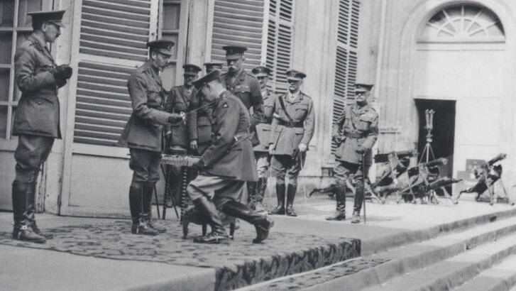 King George V, knighting Lieutenant-General Sir John Monash, Australian Corps commander, at the corps headquarters in August 1918. Photo: Australian War Memorial