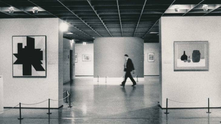 A NGV guard walks past the bare wall where Picasso's Weeping Woman had hung. Photo: Bruce Postle