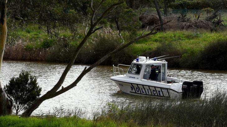 The police and SES are searching along the Maribyrnong River. Photo: Penny Stephens