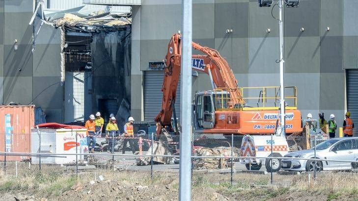 The clean-up continued on Wednesday at Essendon Airport's DFO.  Photo: Justin McManus