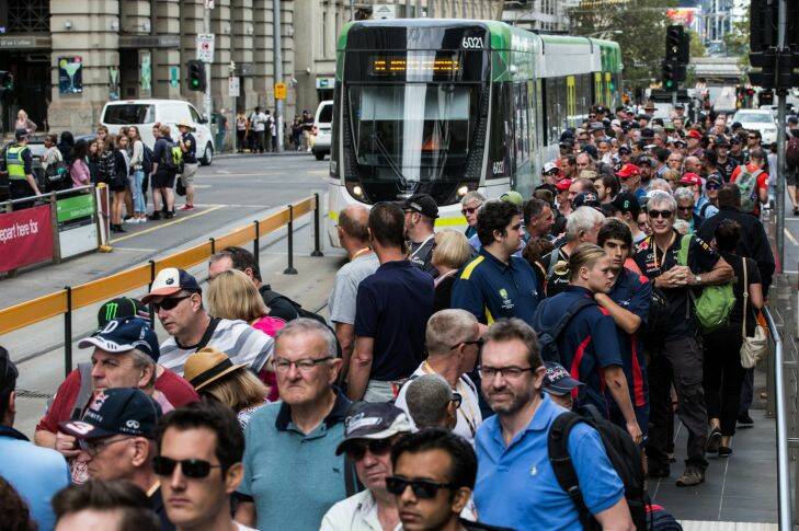 Big crowds wait in line to catch a tram to the Formula One Grand Prix. 24th March 2017. Photo by Jason South Photo: Jason South