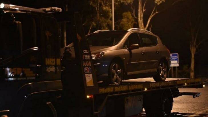 The Peugeot, in which the teenager was found, is towed from the scene. Photo: Jodie Wiegard/Bendigo Advertsier
