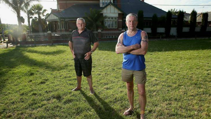 Alan Turner (right) and Paul Robinson live next to land Melbourne Water wants to sell in Rona Street, Reservoir. The land has long been used as a park.  Photo: Pat Scala