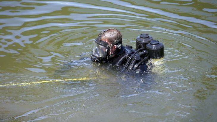 A police diver in the Maribynong River. Photo: Simon O'Dwyer