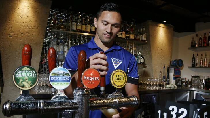 Jordan Rapana working as a bartender in 2013. Photo: Jeffrey Chan