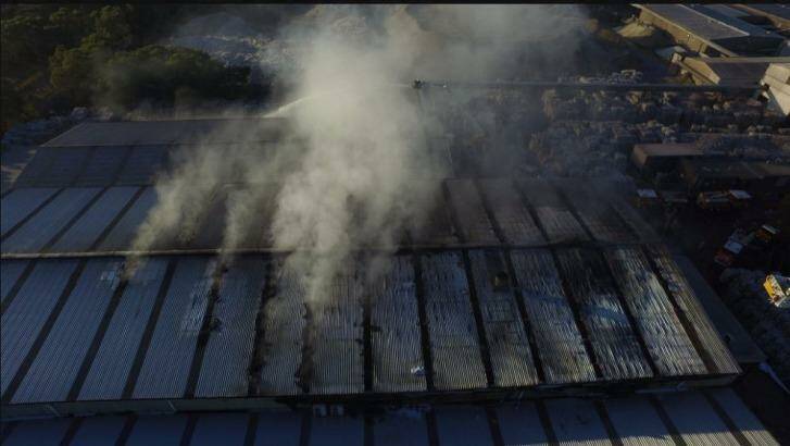 An aerial image of firefighters trying to control the Coolaroo blaze from a cage above the factory. Photo: MFB_NEWS
