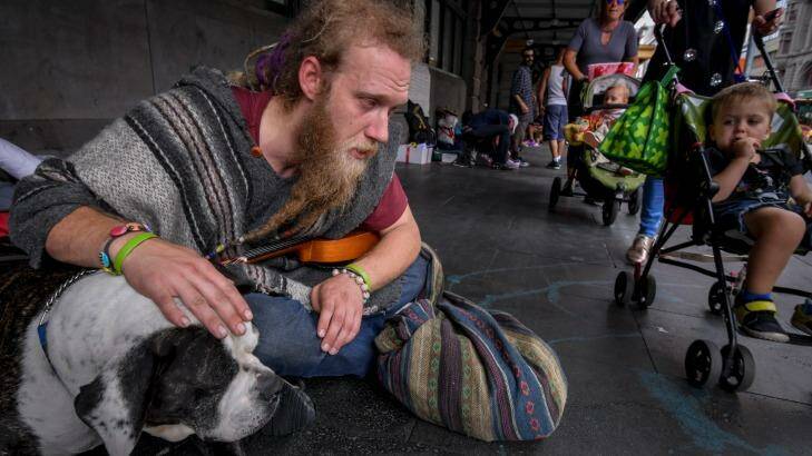 Glen, 32, with his dog, Tonka, at the Flinders Street Station camp. Photo: Eddie Jim
