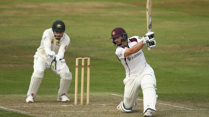 Flaying the bowlers: Northamptonshire's Adelaide-born batsman Steven Crook bats as Australian keeper Peter Nevill looks on during day two of the tour match at The County Ground in Northampton. Photo: Ryan Pierse