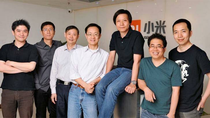 Lei Jun, founder, chairman and CEO of Xiaomi (seated) with his seven co-founders. Photo: Xiaomi