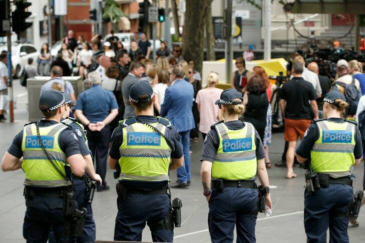 MELBOURNE, AUSTRALIA - December 28 . Members of Victoria Police look on as the Minister for Police, Lisa Neville speaks to the media on December 28 , 2017 in Melbourne, Australia. (Photo by Darrian Traynor)
