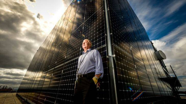 Engineering services manager Bill Burgess next to the solar panels near the top of 101 Collins. Photo: Justin McManus