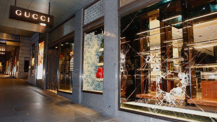 Sledgehammers were used to smash into the Gucci handbags store on Collins Street. Photo: Eddie Jim