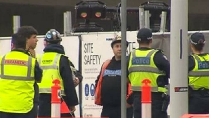Police and union officials at the scene. Photo: Courtesy of Ten News