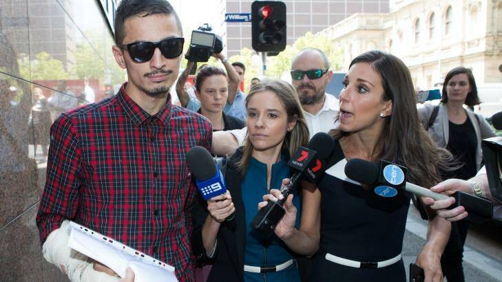 Reporters surround Angelo Gargasoulas as he leaves the Melbourne Magistrates Court after an earlier hearing. Photo: Jason South