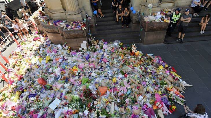 The public lay flowers at Bourke Street after five people died. Photo: Joe Armao