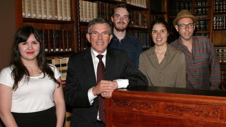 Arts Minister Ian Walker (in suit) with Queensland Writers Fellowship winners Sophie Overett, Ellen van Neerven and David Stavanger, and Queensland Premier's Young Writers Fellowship winner Jack Vening (centre, at rear). Photo: Supplied