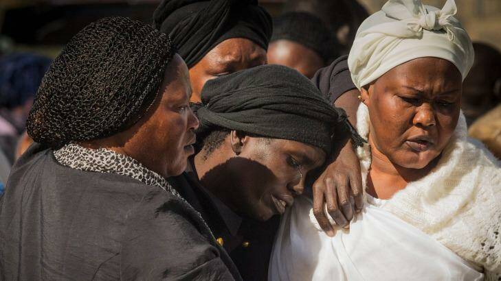 Akon Guode at the funeral for her three children last year. Photo: Chris Hopkins