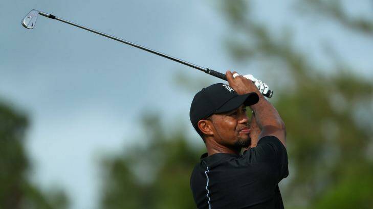 Tiger Woods in action in the Bahamas... the golfing great is no stranger to Australian shores. Photo: Christian Petersen