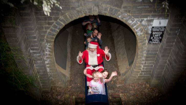 Stephen Fox, as Santa, and children at Kalparrin centre for special needs children's Christmas party. Photo: Penny Stephens