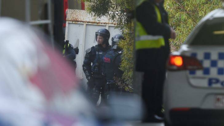 Police in riot gear outside the Parkville Youth Justice Centre on Monday. Photo: Justin McManus