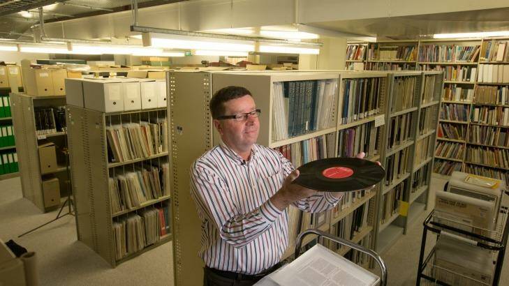 Out of the vault: Arts collection manager Dermot McCaul in the State Library of Victoria basement where part of its vast vinyl record collection is stored. Photo: Simon Schluter