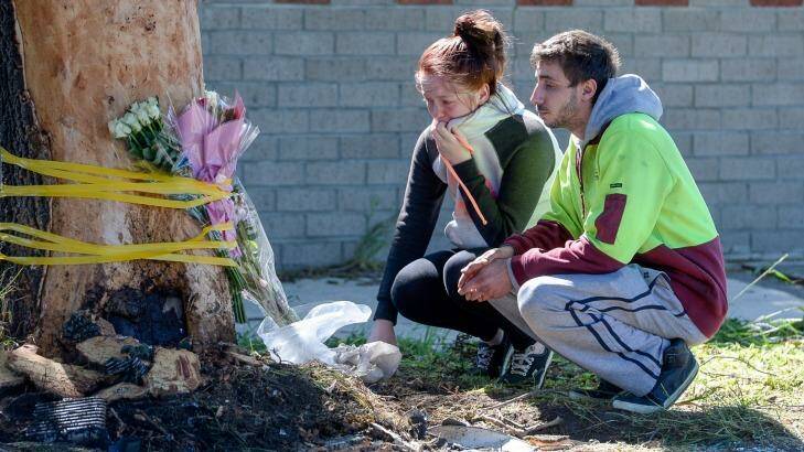 Luke's sister Jade Lee at the crash scene, where friends and family left tributes. Photo: Justin McManus