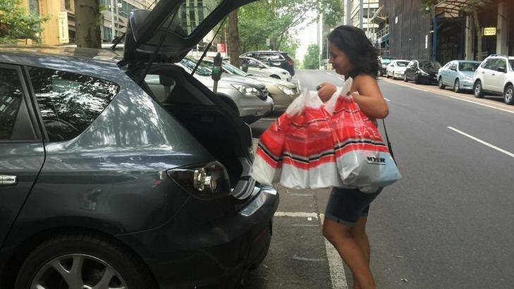 Michelle Barnard-Marks loads her car with her Boxing Day shopping bags. Photo: Daniella Miletic